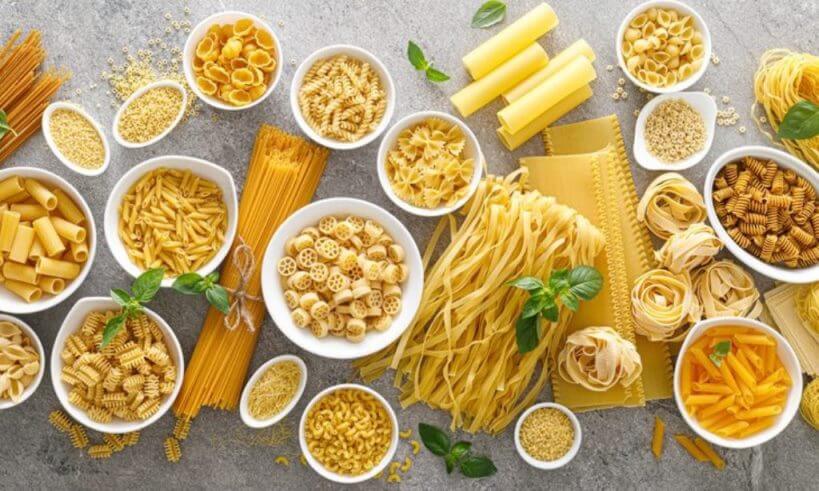Pasta.,Various,Kinds,Of,Uncooked,Pasta,And,Noodles,Over,Stone Diverse Palette: An Exploration of Different Types of Pasta Sauces Worldwide